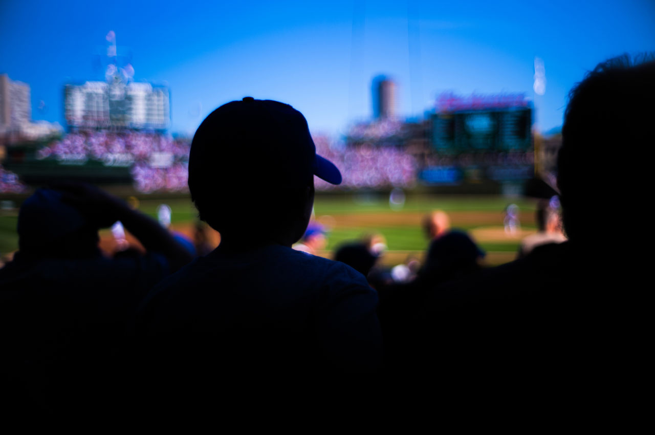 Spectator overlooking baseball diamond